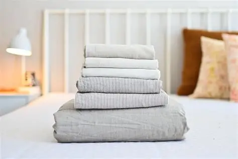 Folded sheet set on bed